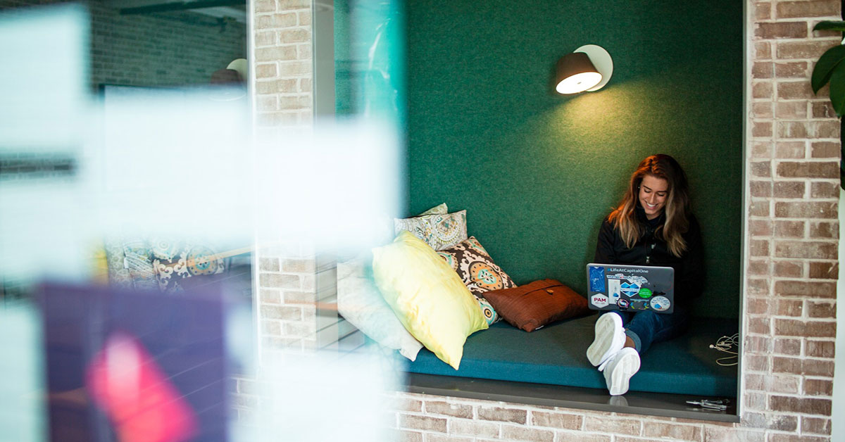 woman working on an computer in an alcove