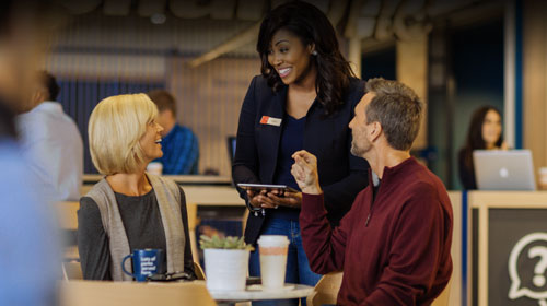 employee talking with two customers