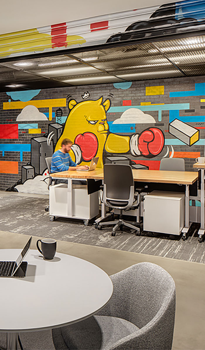 Office space with graffiti on wall