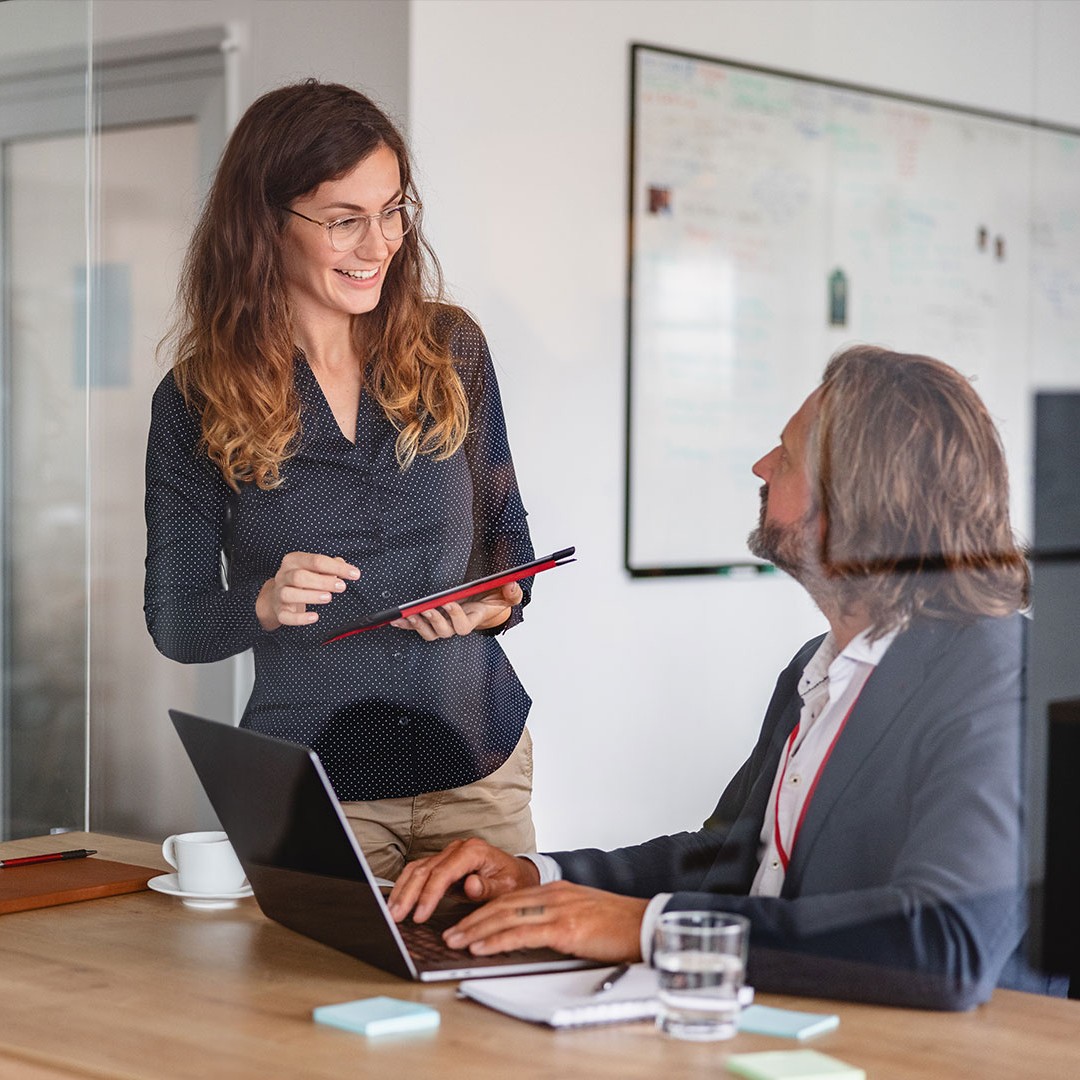 Employees talking in office