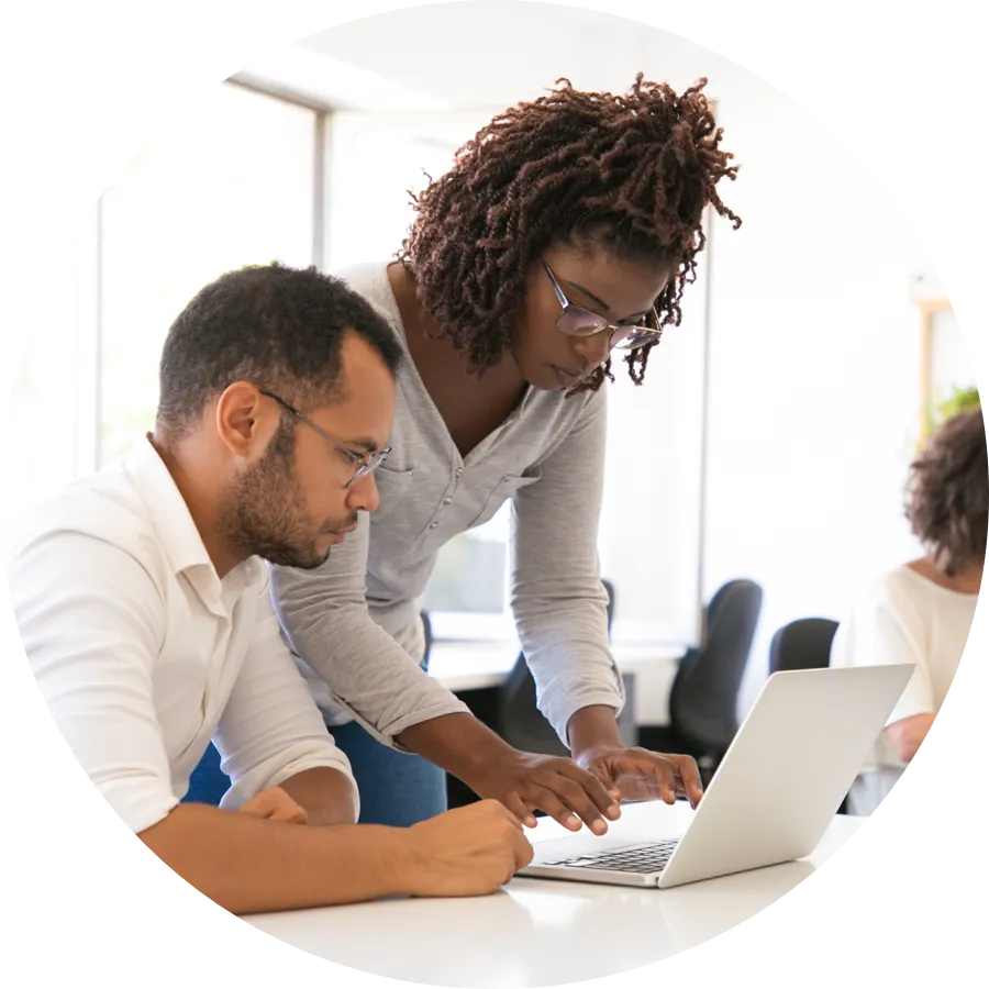 Two person watching laptop