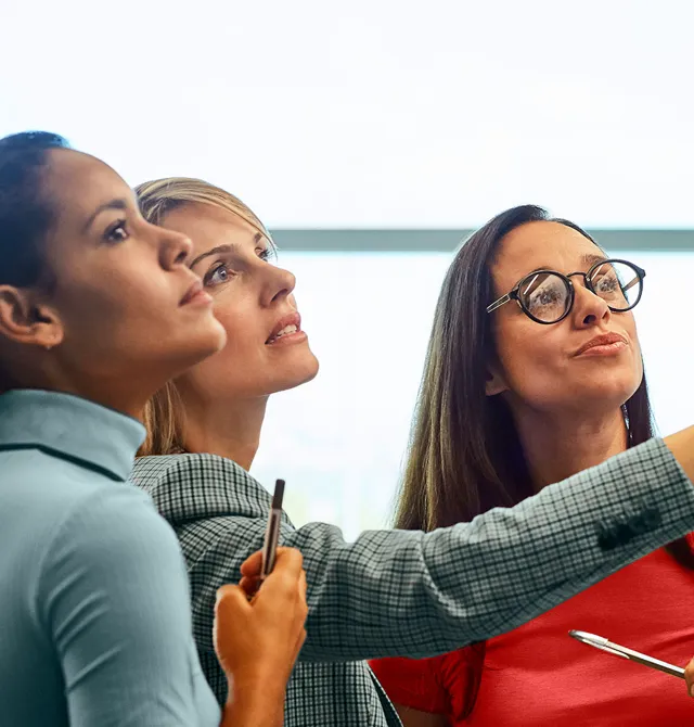 Team members having discussion on board