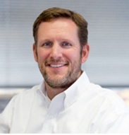 headshot of DOUG DIXON