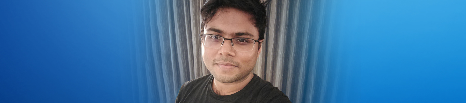 Portrait image of Rakesh looking to camera. 