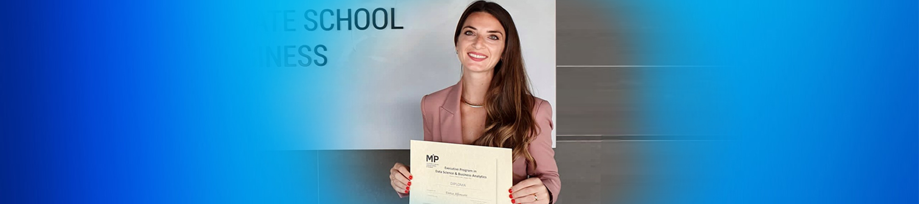 A photo of Enrica holding a graduation certificate
