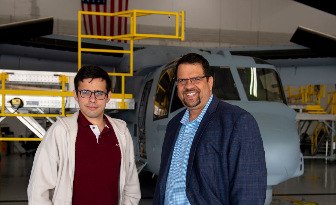 Thomas and Peter standing in front of an MV-22 aircraft. 