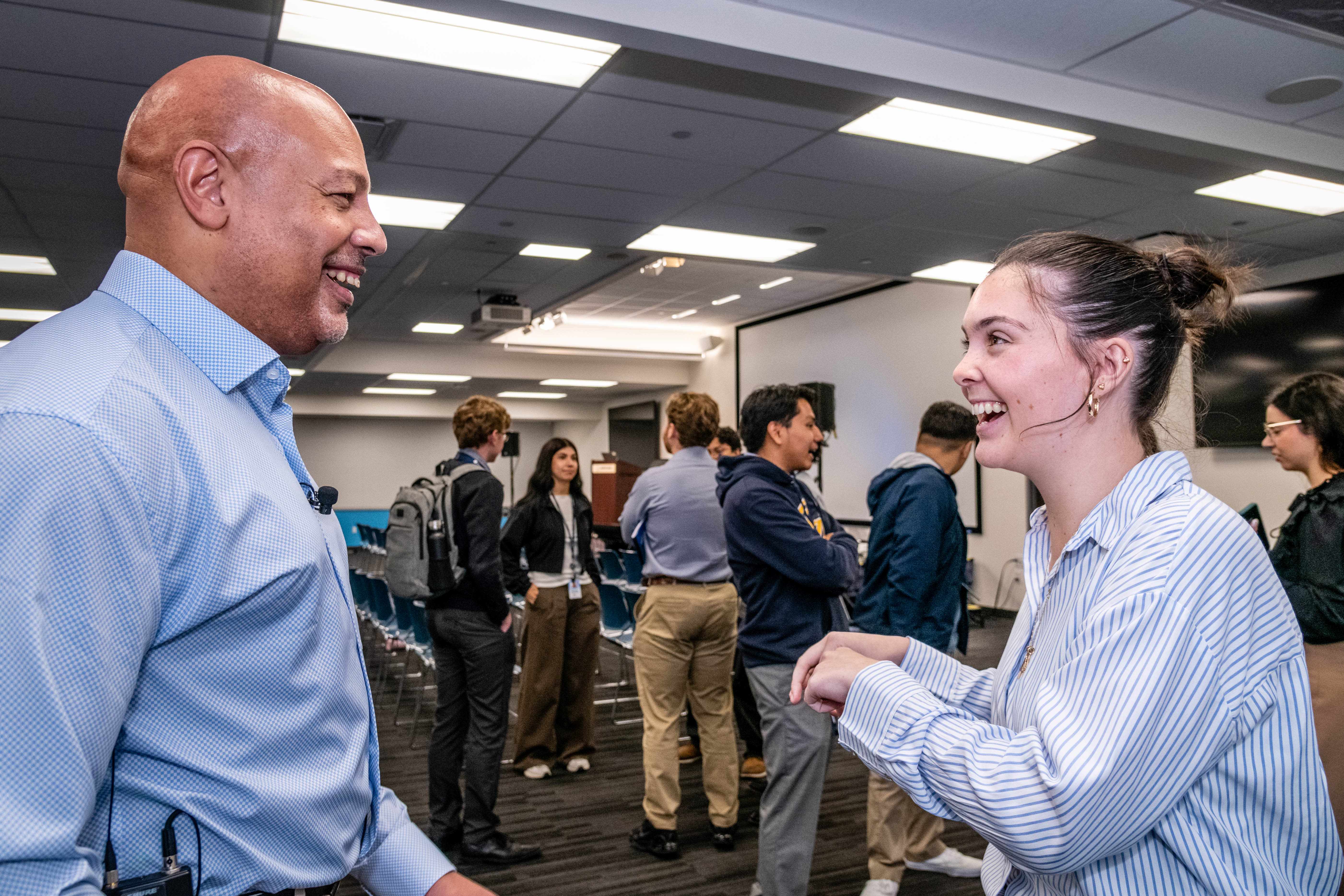 Howard and Riley Keenan networking with leaders