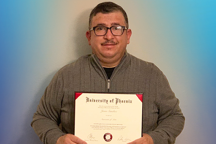 Jesus holding his diploma