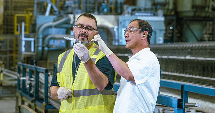 Two employees working together
