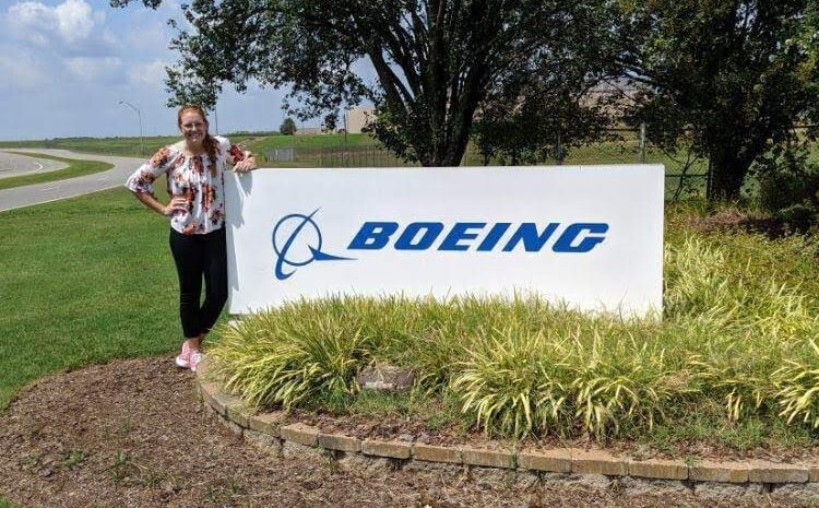 Abbey next to a Boeing sign