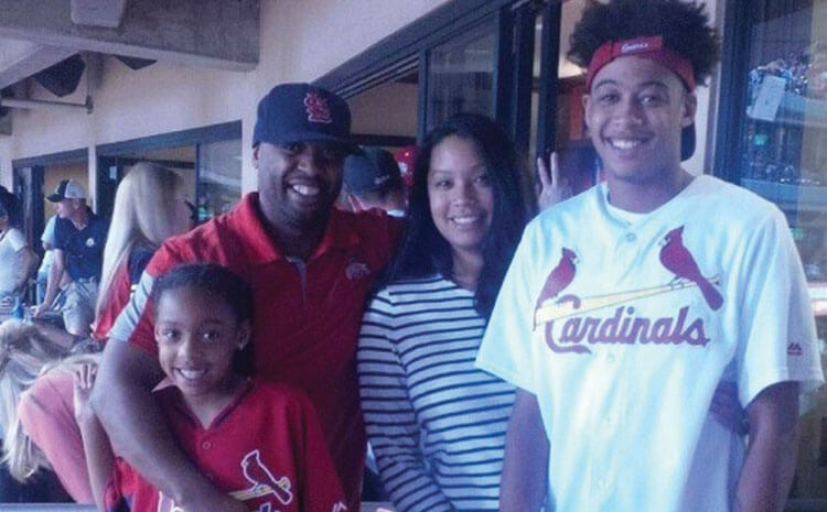 Terrence and his family at a Cardinals baseball game