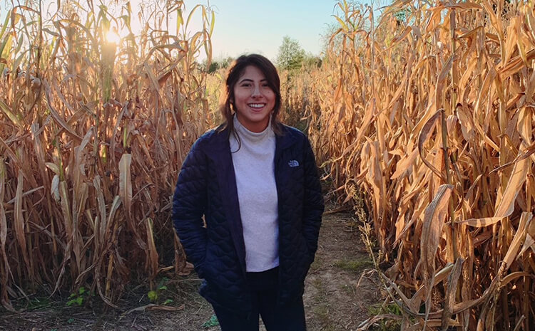 Marcela in a corn field