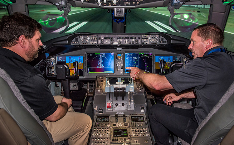 female engineer testing the control panel in an airplane cockpit