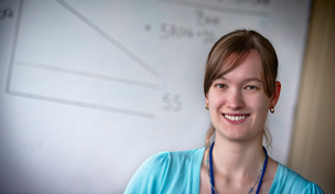 College intern in front of white board