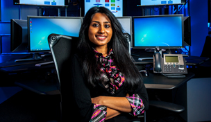 Woman sitting at chair in cyber center