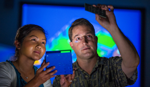Male and female engineers at work