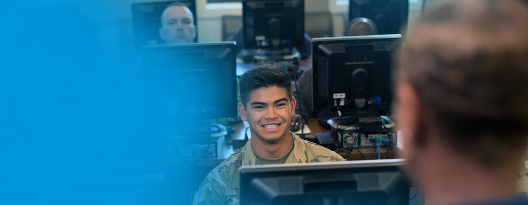 Military students in training classroom.