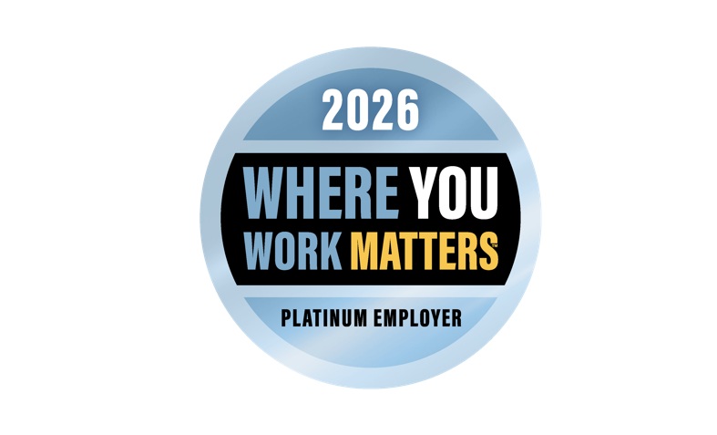 Boeing airliner flying above clouds and mountains