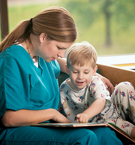 nurse reading with child