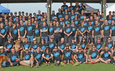 A large group of CH Robinson employees at a charity event