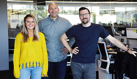 large group photo in stadium office setting