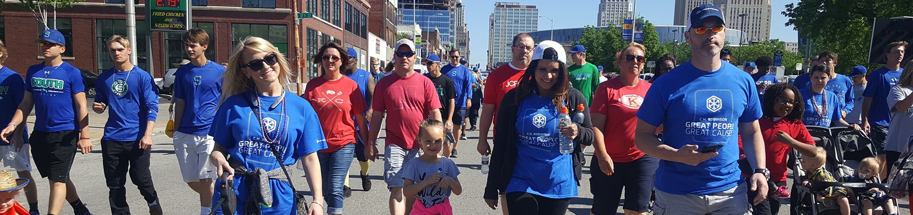 Large group of people walking down street for C.H. Robinson Great People Great Cause walk