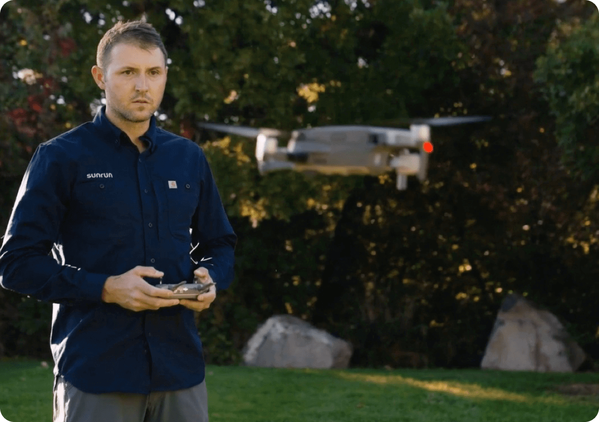 Sunrun employee operating remote controlled drone