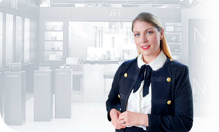 Female employee in the office smiling for a picture