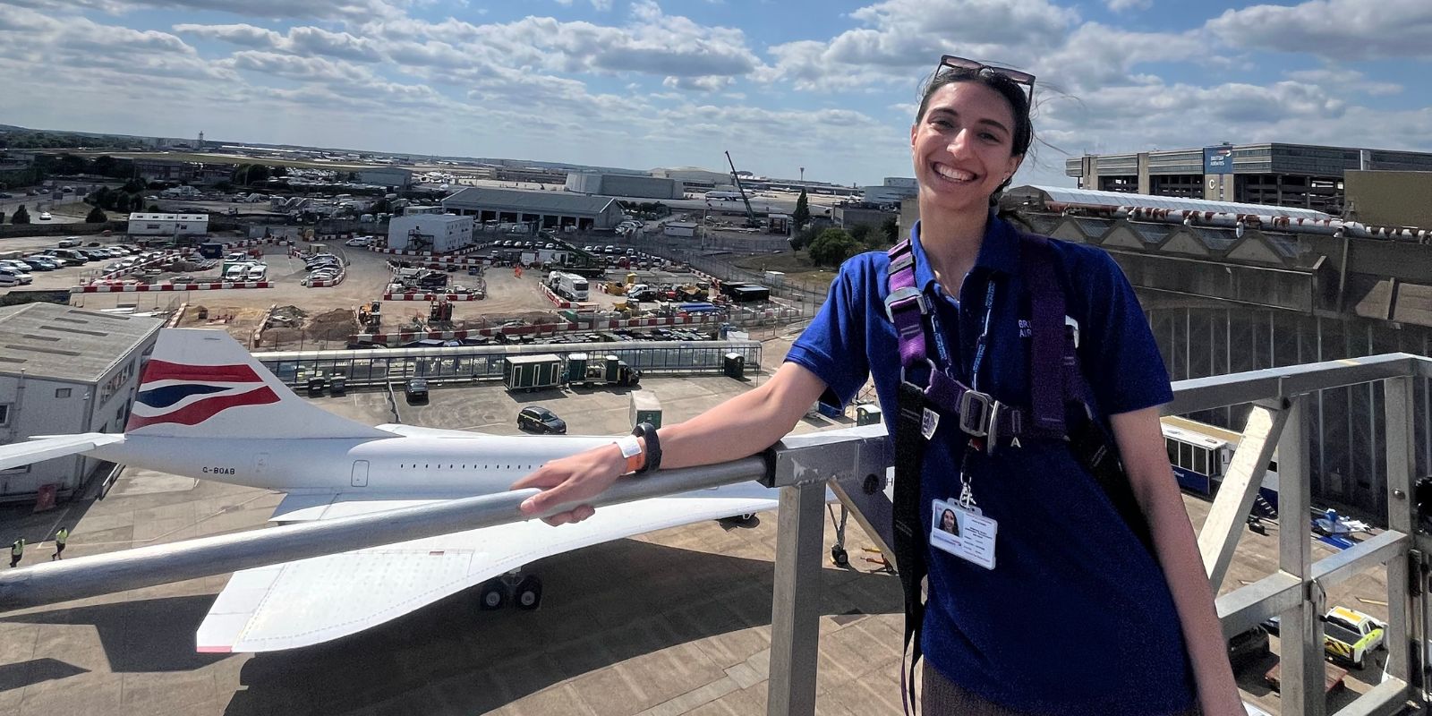 Graduate standing near Concorde