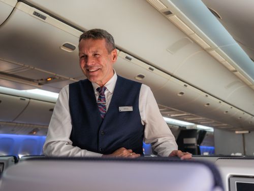 Inflight Lead smiling on aircraft