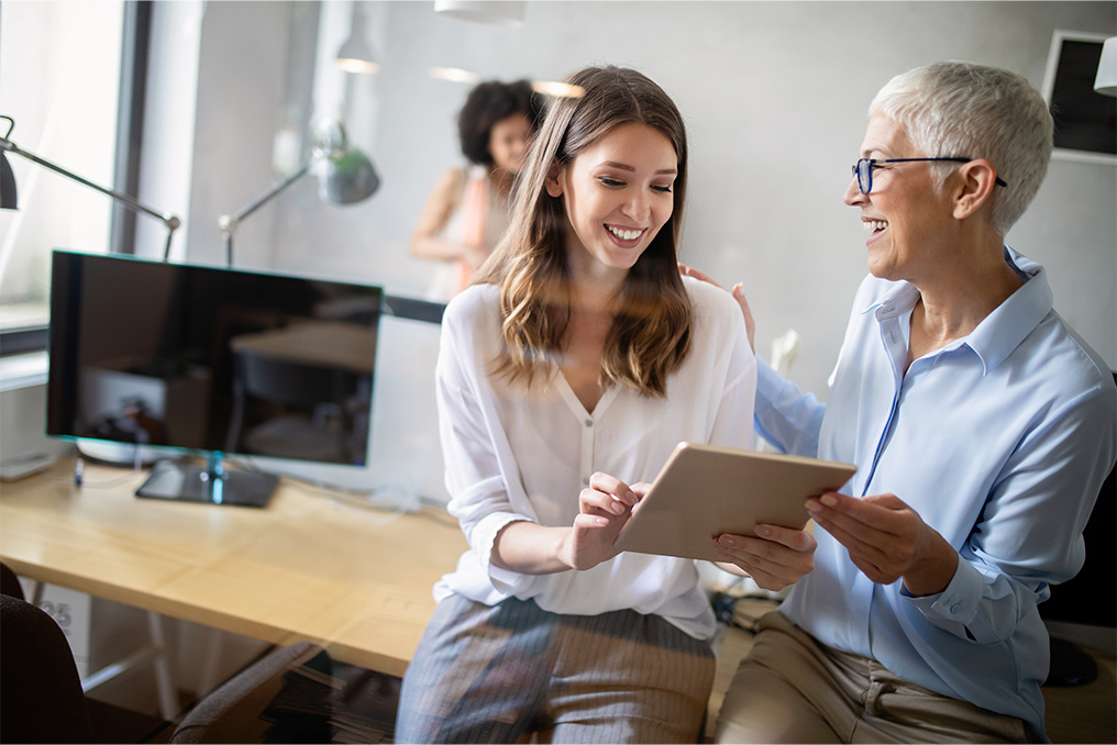 two people talking in an office environment