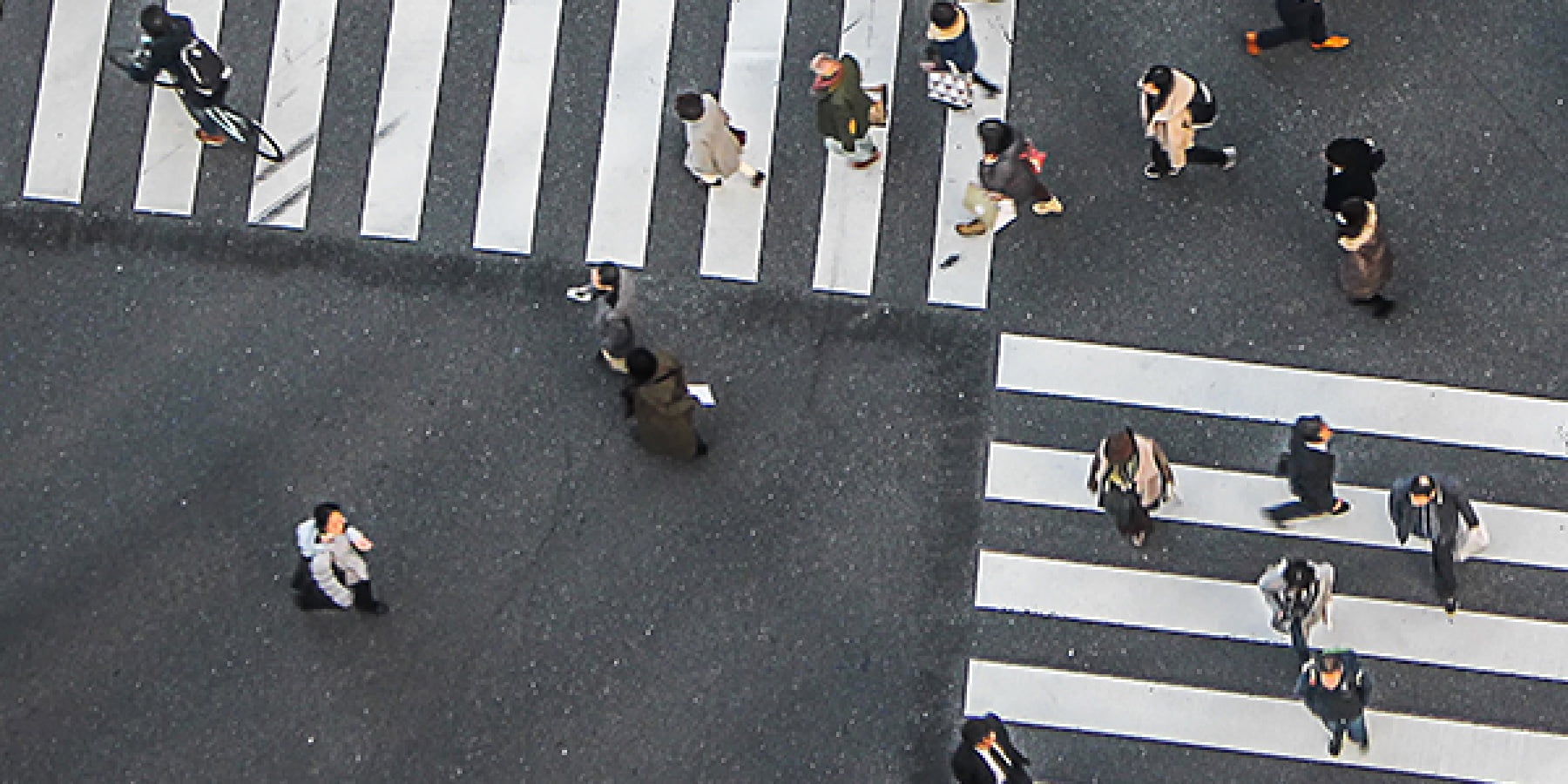 Top down image of people on a zebra crossing