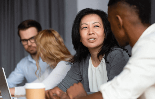 Female and male staff members talking