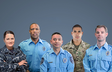 Five uniformed security professionals stand shoulder to shoulder against a solid blue backdrop, wearing a mix of light blue and camouflage uniforms, presenting a composed and professional team appearance.