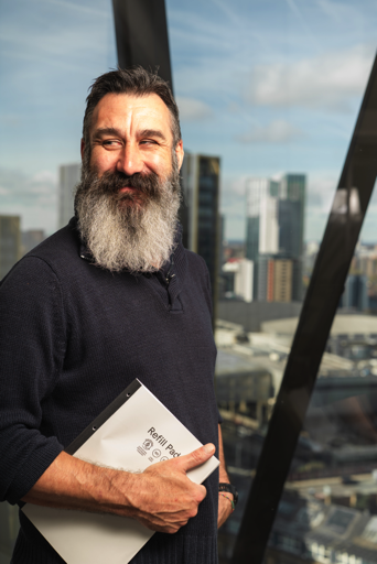 Man sits at table inside Co-op's head office