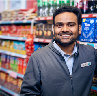 A man in Co-op uniform smiling