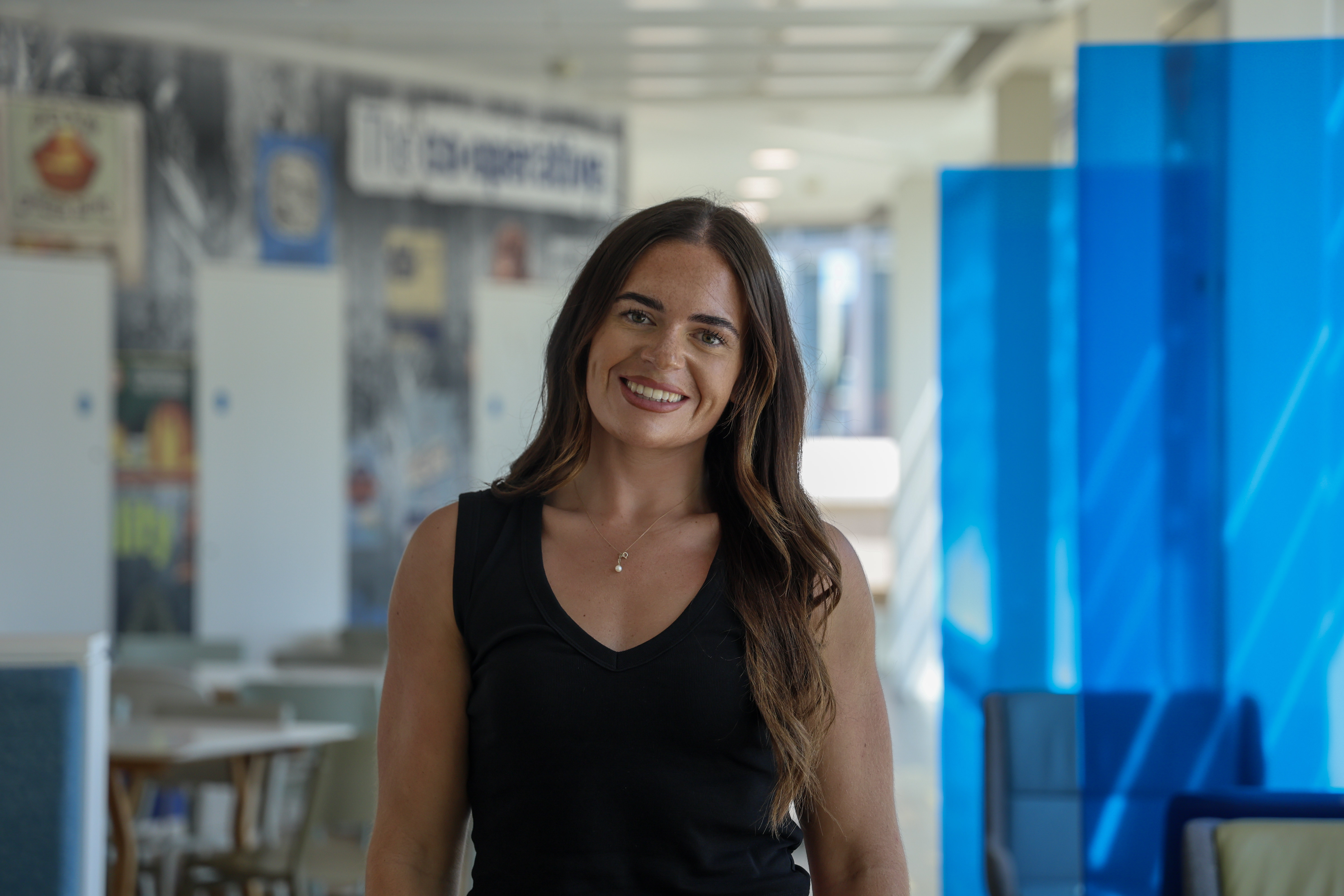 Smiling woman in the colleague coffee shop