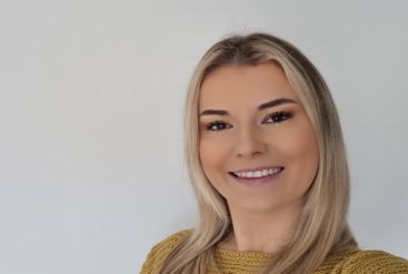girl with blonde hair smiling