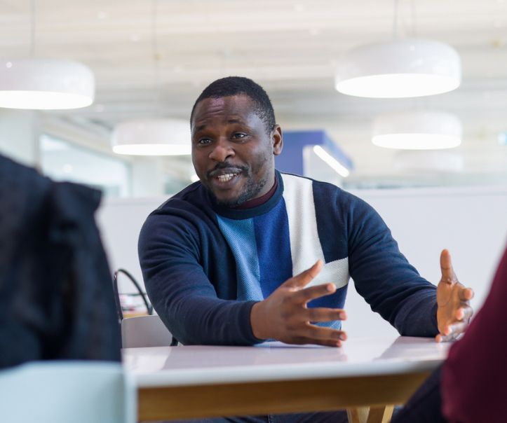 Man sitting in a chair in a meeting room