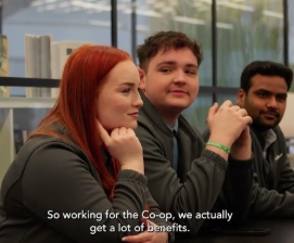 two men and a women sitting next to each other