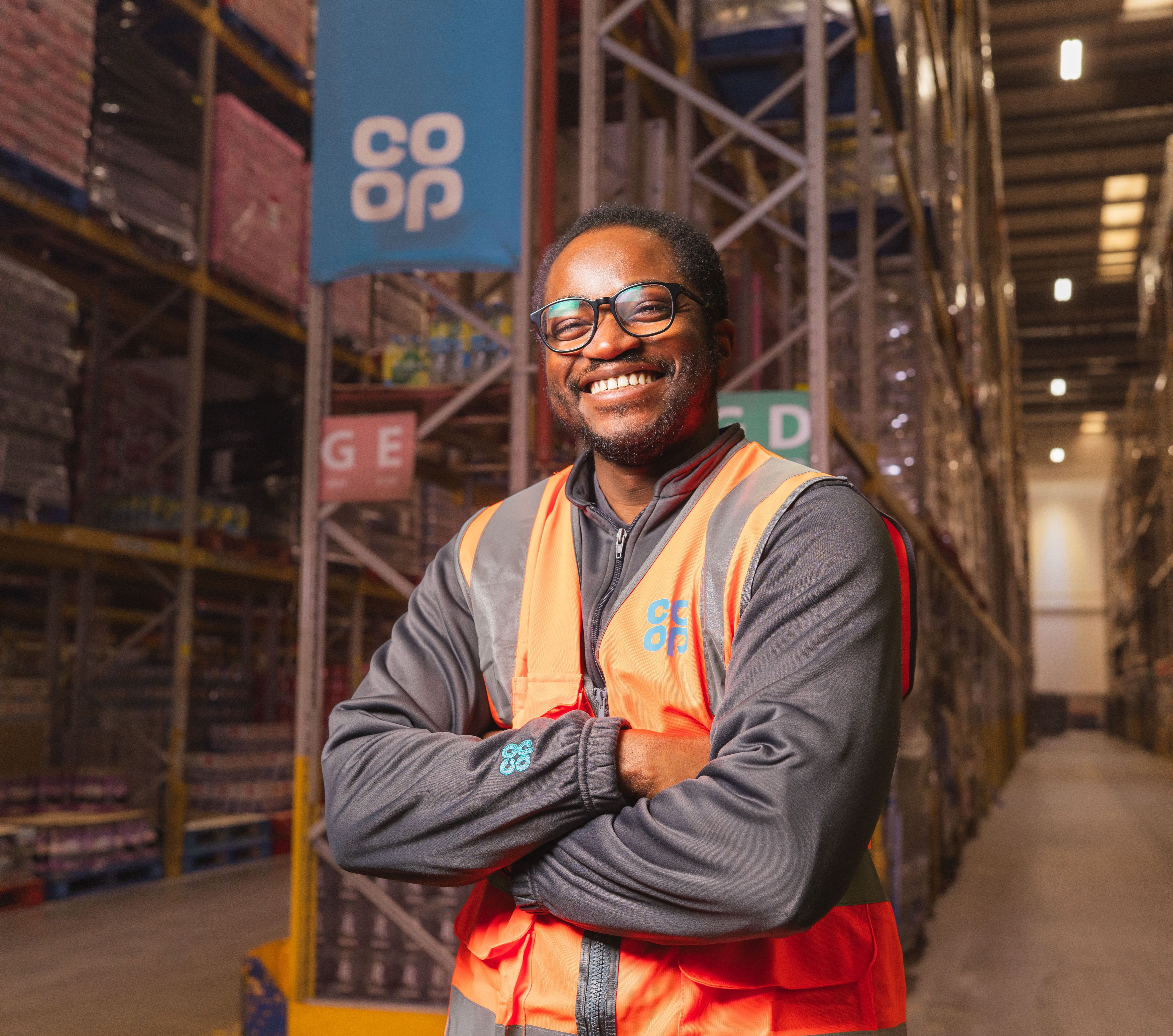A worker standing in a warehouse