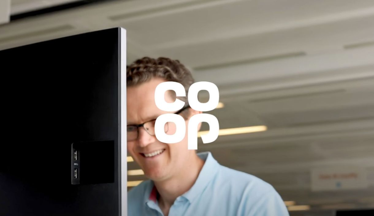 man smiling at computer