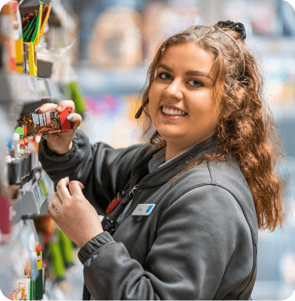 Smiling employee working in a retail environment