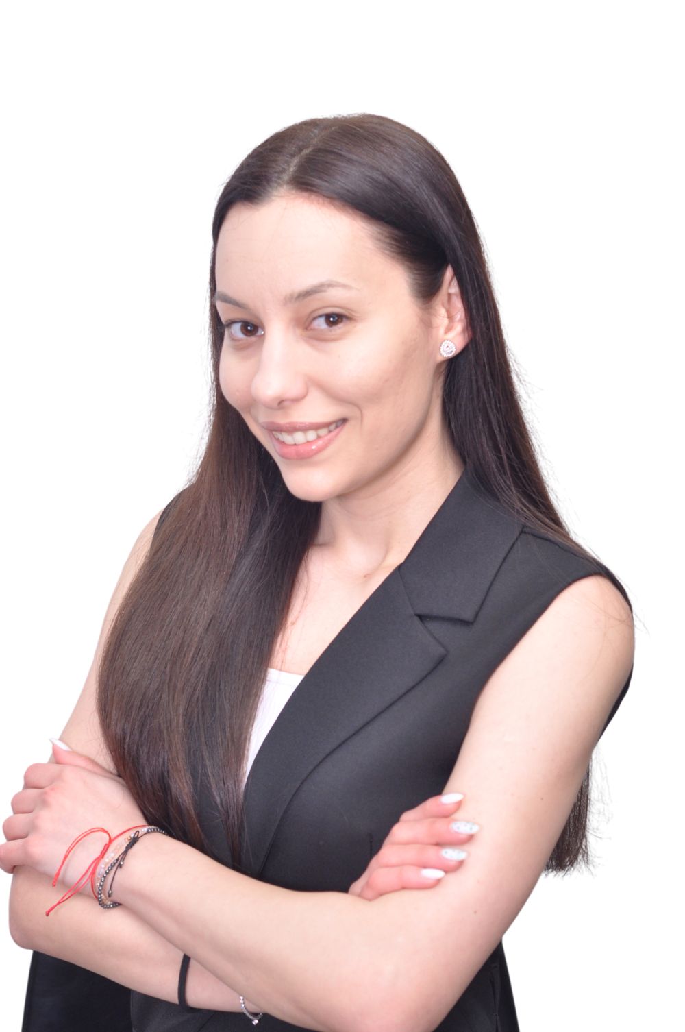 Cargill early careers professional wearing a white top and black sleeveless blazer, photographed against a neutral studio-style background, representing confidence, professional growth, and early career development opportunities.