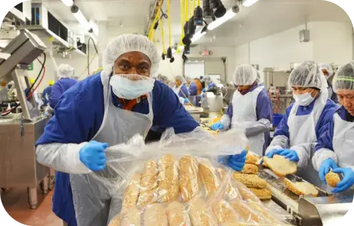 Employee packing bread