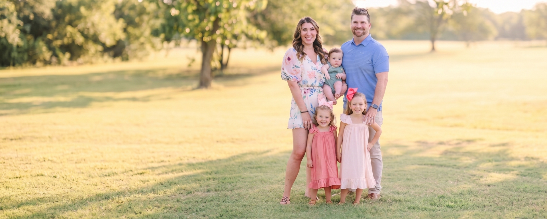 Capital One VP Brittany Courtney stands with her husband and 3 children outside
