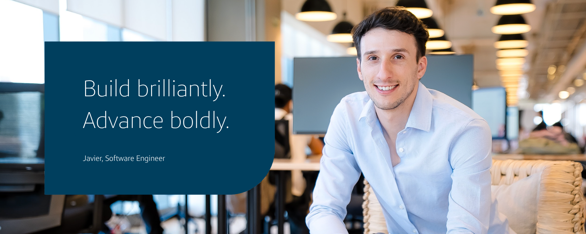 Capital One Mexico City associate Javier sits on a chair wearing a blue shirt and writing on a notepad. The image says "Build brilliantly. Advance boldly." "Javier, Software Engineer"