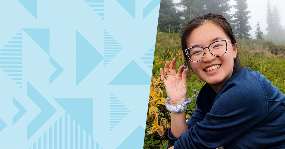 Capital One associate Anna sits outsite in a foggy field, image is next to a two-toned blue triangular background