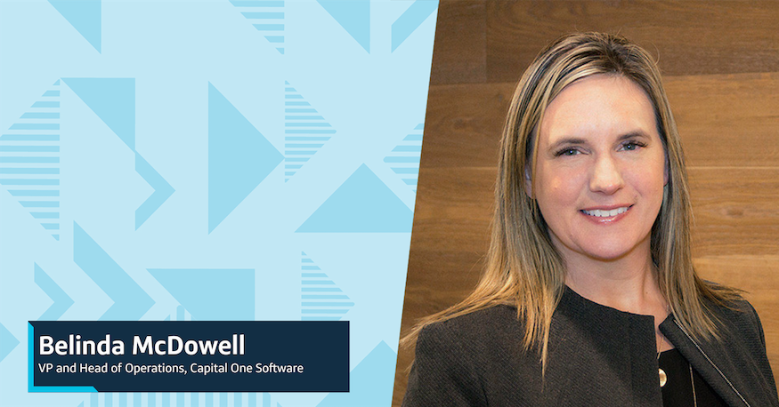 A headshot image of Belinda, VP and Head of Operations, Capital One Software, in front of a wooden wall, next to a two-toned triangular background