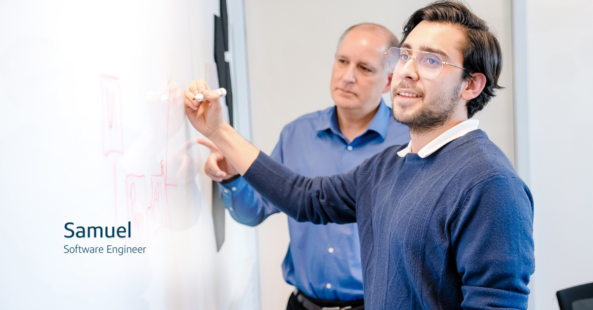 Capital One associate Samuel writing on a whiteboard